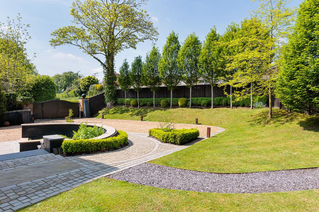 Elevated view across the gardens showing the scale and mature landscaping