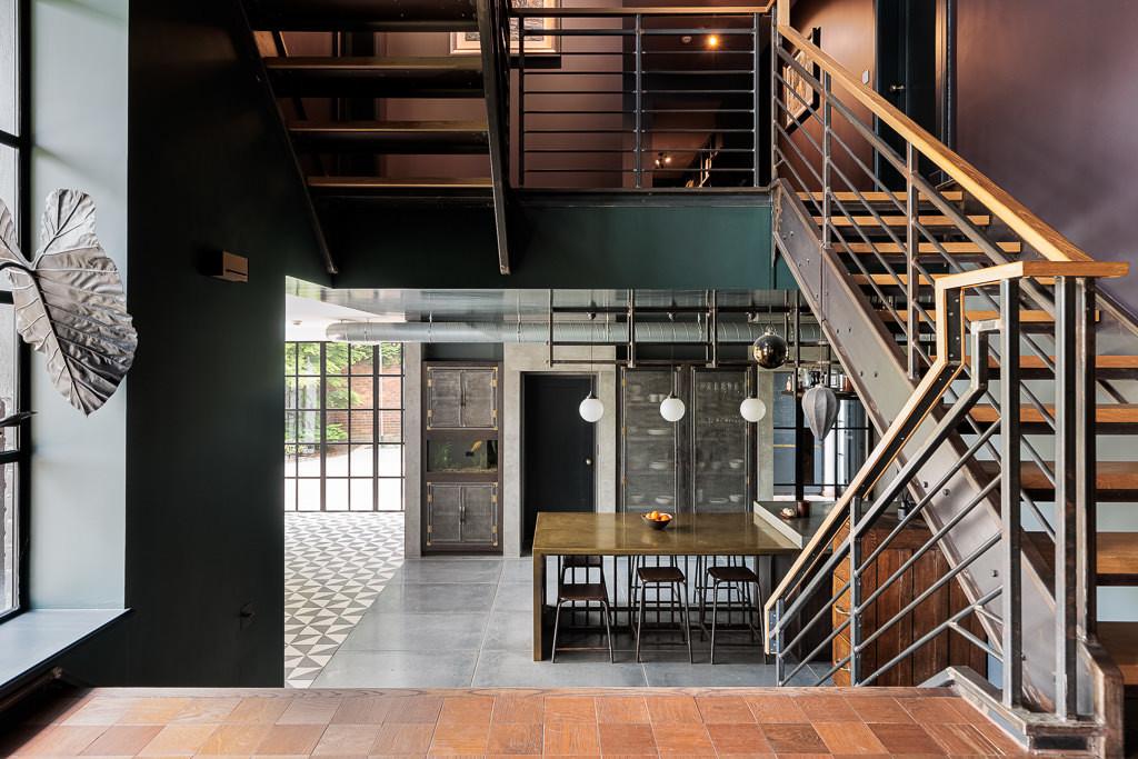 Galleried entrance hall with modern oak and wrought-iron staircase
