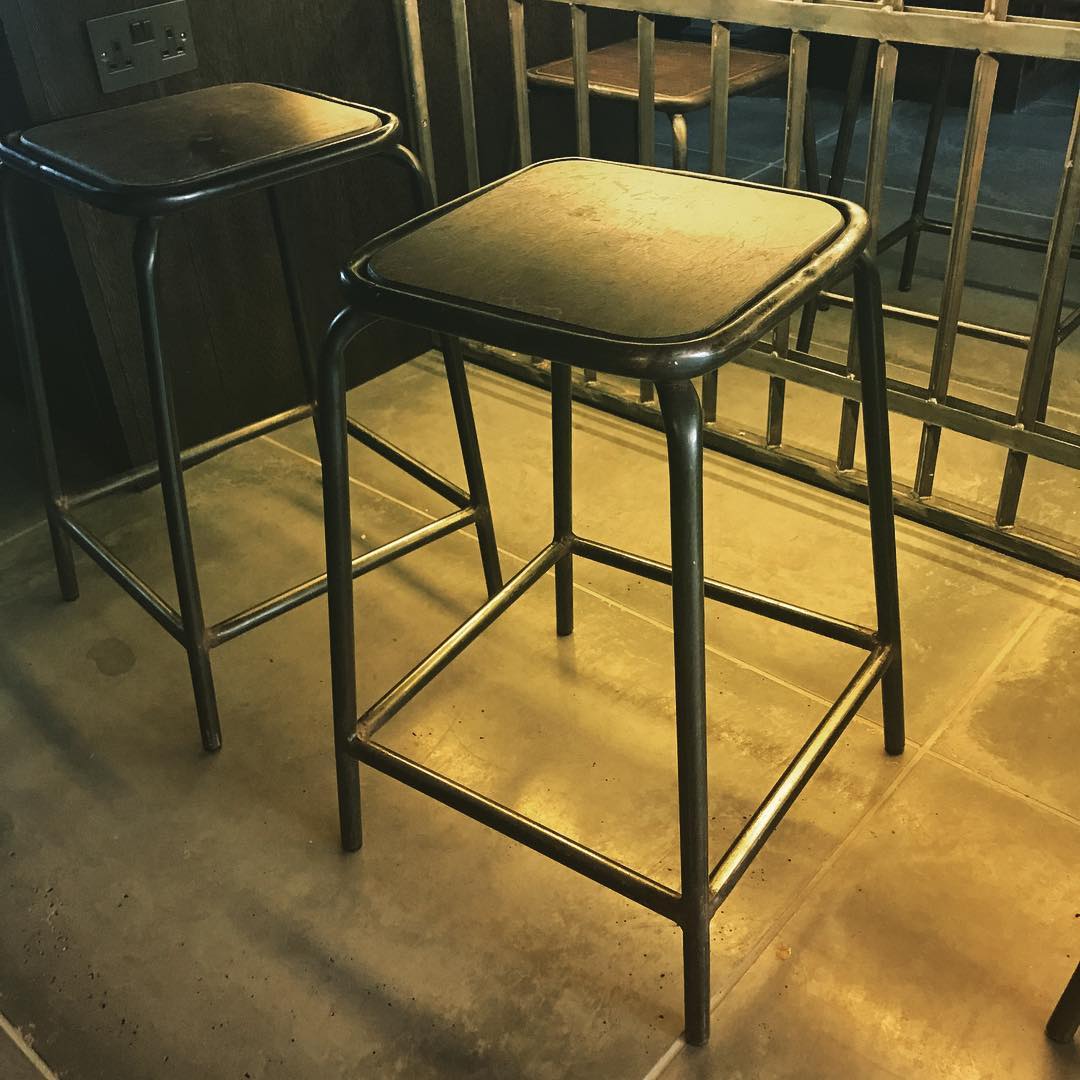 Industrial-style bar stools and steel balustrading