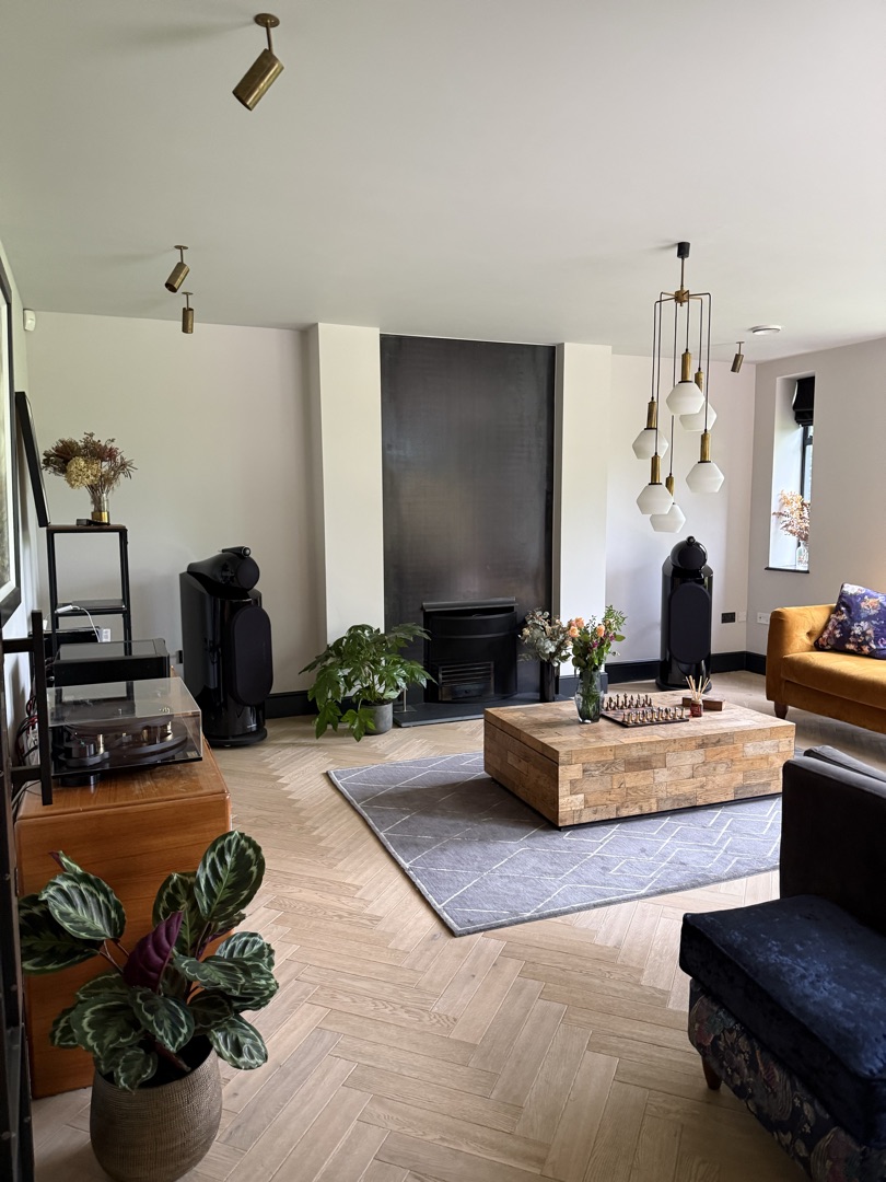 The Ponds Goostrey — living room with feature fireplace, hi-fi system and herringbone flooring