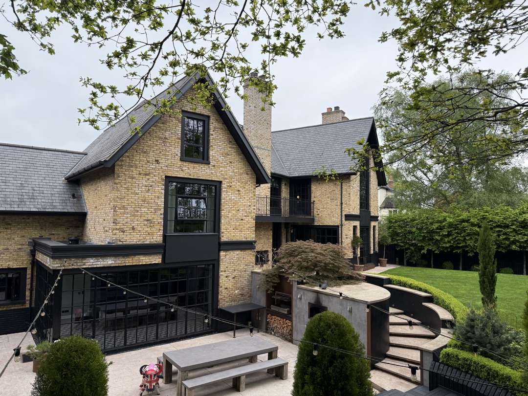 The Ponds Goostrey — rear with outdoor dining terrace, BBQ area and curved garden steps